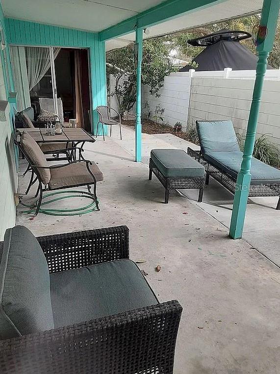2695 S E Ave, Sarasota, FL 34239 - fenced backyard with a patio