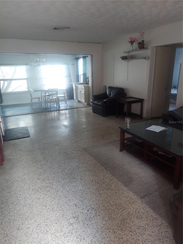 2695 S E Ave, Sarasota, FL 34239 - living room featuring speckled floor