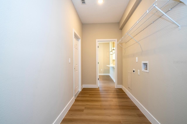 hallway with wood-type flooring