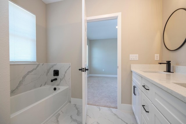 bathroom featuring a tub to relax in and vanity