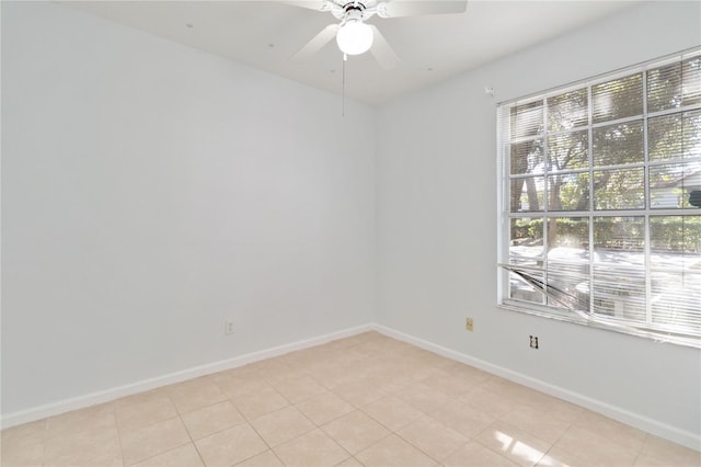 tiled empty room with ceiling fan