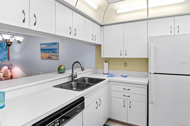 kitchen with white cabinetry, sink, light tile patterned floors, and white appliances