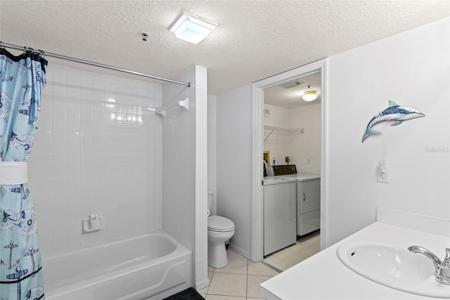 full bathroom with washing machine and clothes dryer, shower / bath combo, tile patterned flooring, a textured ceiling, and vanity