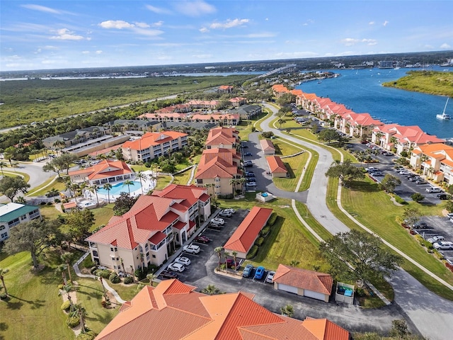 birds eye view of property with a water view