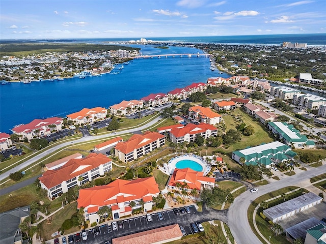 birds eye view of property with a water view