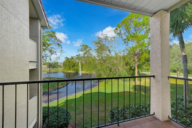 balcony featuring a water view