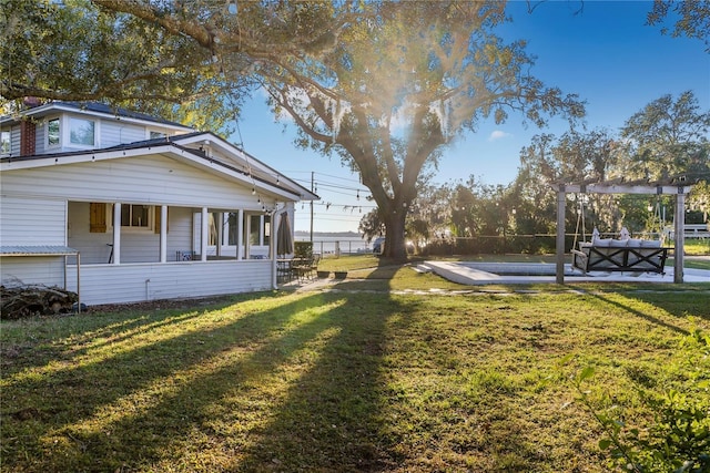 view of yard with outdoor lounge area, a pergola, and a patio area