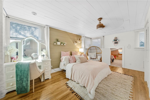 bedroom featuring light hardwood / wood-style floors and wooden ceiling