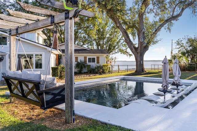 view of swimming pool with a water view and a pergola