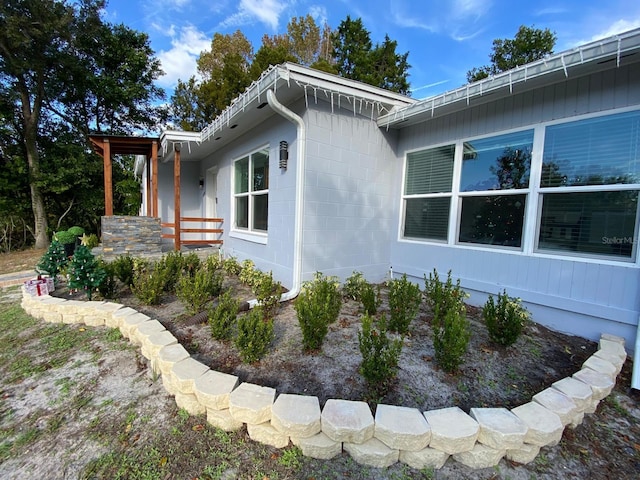 view of side of property with a porch