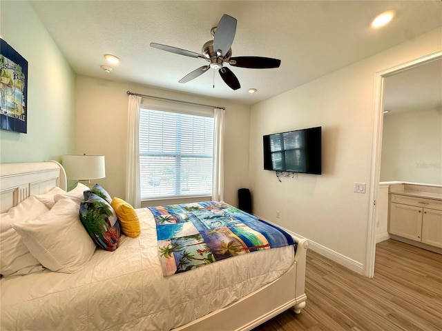 bedroom featuring hardwood / wood-style flooring and ceiling fan