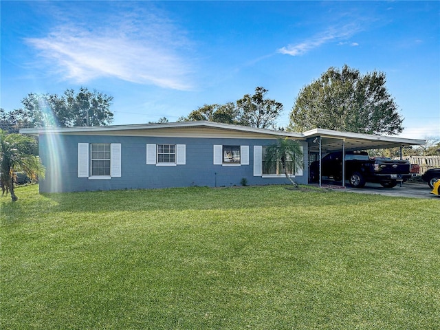 ranch-style home with a front lawn and a carport