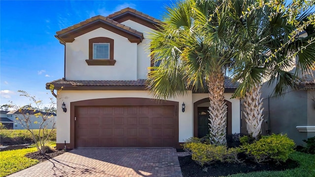 mediterranean / spanish-style house featuring a garage