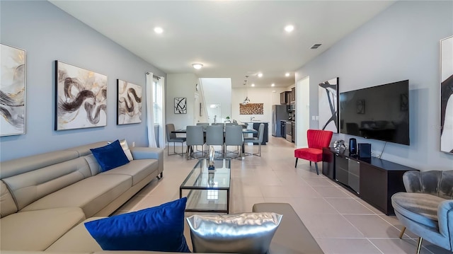 living room with light tile patterned flooring