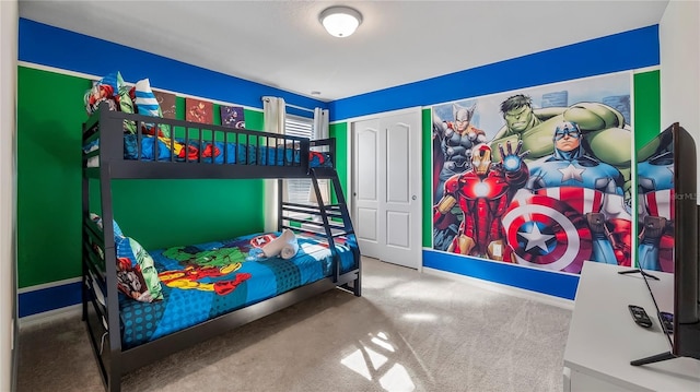 bedroom with carpet floors and a closet