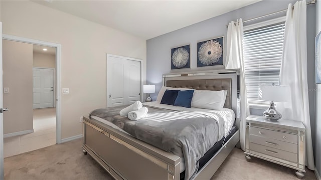 carpeted bedroom featuring a closet