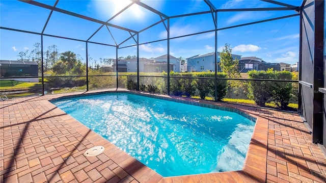 view of pool with a lanai and a patio