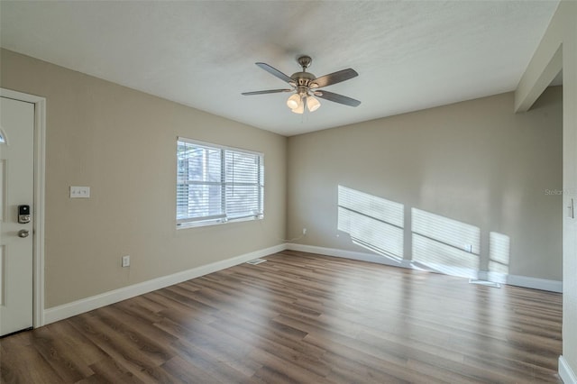 unfurnished room with ceiling fan and hardwood / wood-style flooring