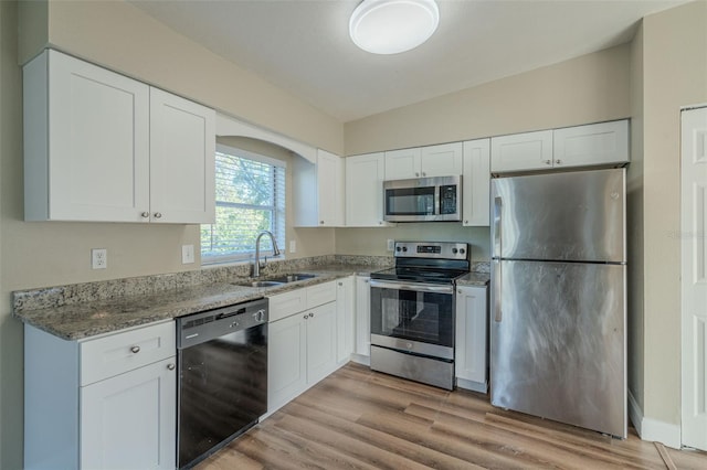 kitchen with white cabinets, sink, and stainless steel appliances