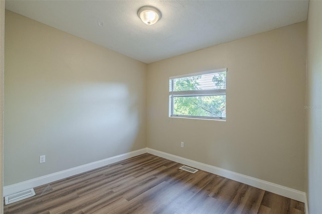 empty room featuring hardwood / wood-style floors