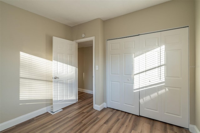 foyer entrance with hardwood / wood-style floors