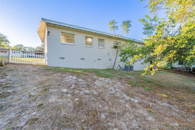 rear view of house with cooling unit