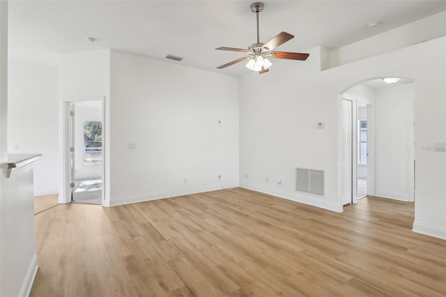 unfurnished living room with ceiling fan and light wood-type flooring