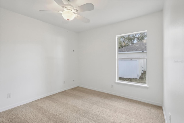 unfurnished room with ceiling fan and carpet floors