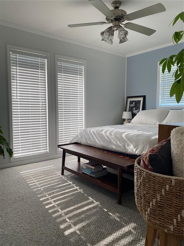 bedroom featuring carpet, ceiling fan, and ornamental molding