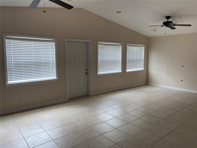 entryway with light tile patterned floors, vaulted ceiling, and ceiling fan