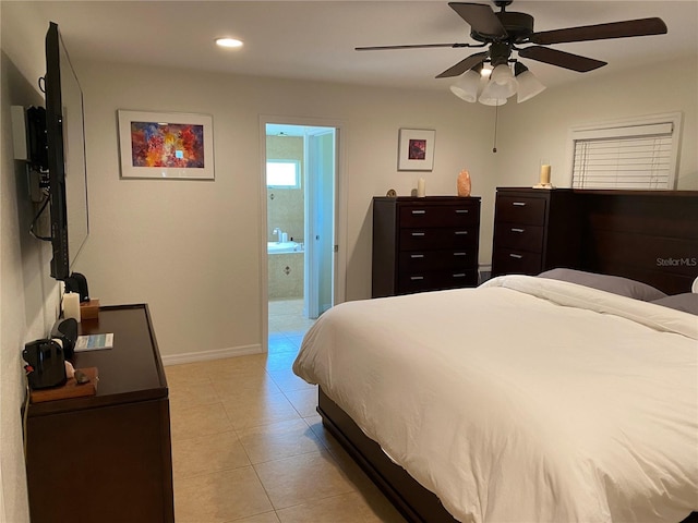 tiled bedroom featuring ceiling fan and ensuite bathroom