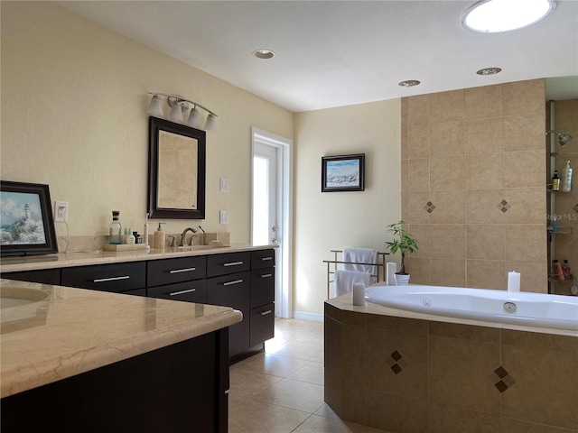 bathroom with vanity, tile patterned floors, and tiled tub