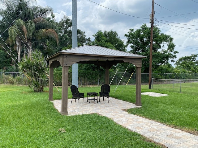 surrounding community featuring a gazebo, a patio, and a yard