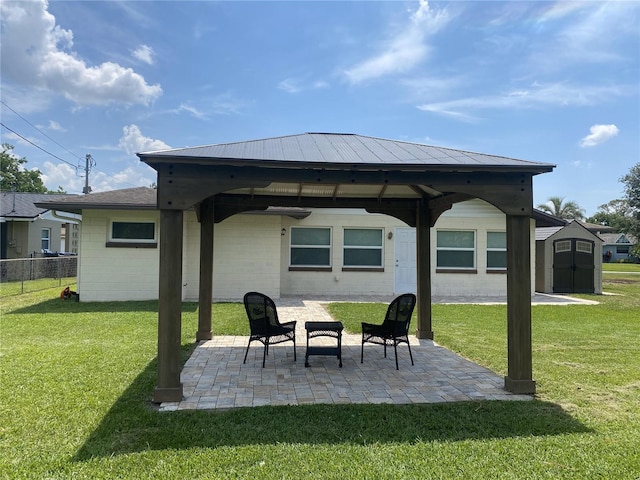 view of patio / terrace with a gazebo and a shed