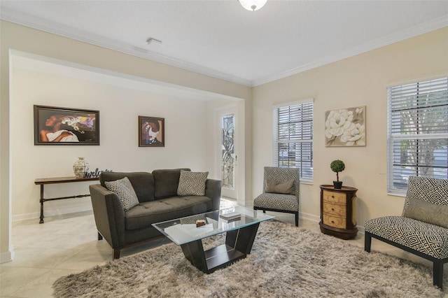 tiled living room featuring a healthy amount of sunlight and crown molding