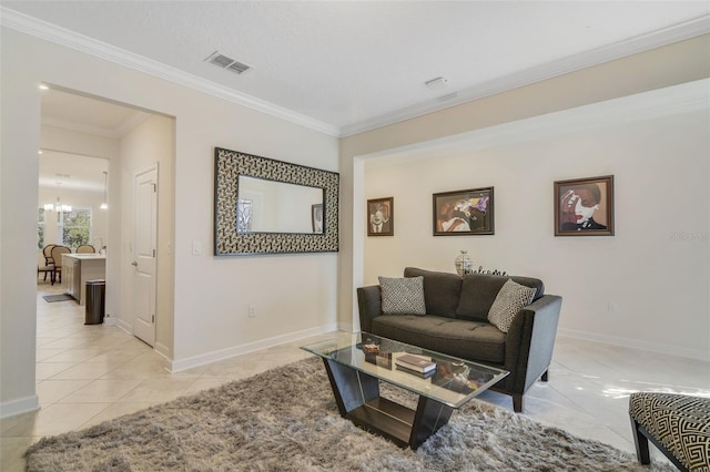 living room with light tile patterned floors, a notable chandelier, and ornamental molding