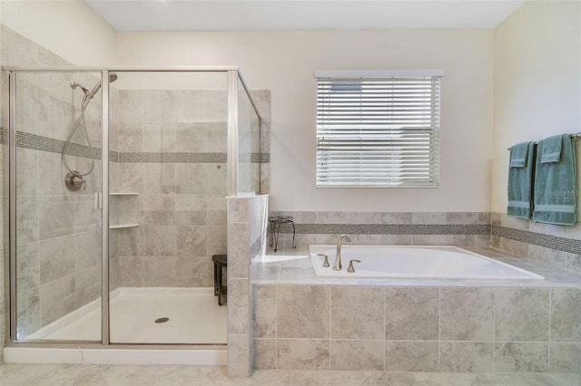 bathroom with shower with separate bathtub