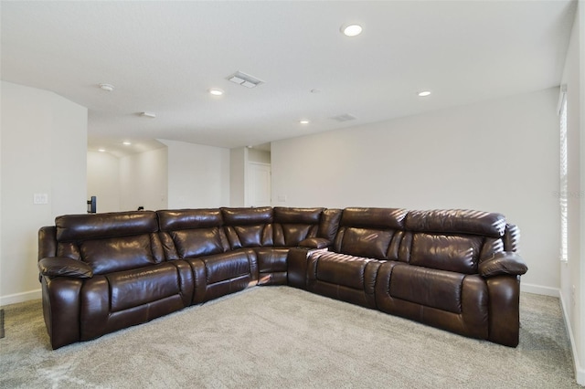 home theater featuring light carpet