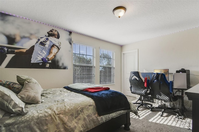 bedroom with carpet and a textured ceiling