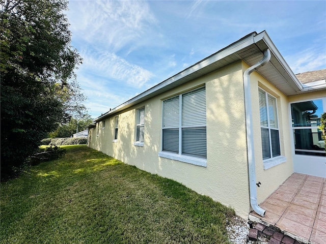 view of home's exterior featuring a lawn