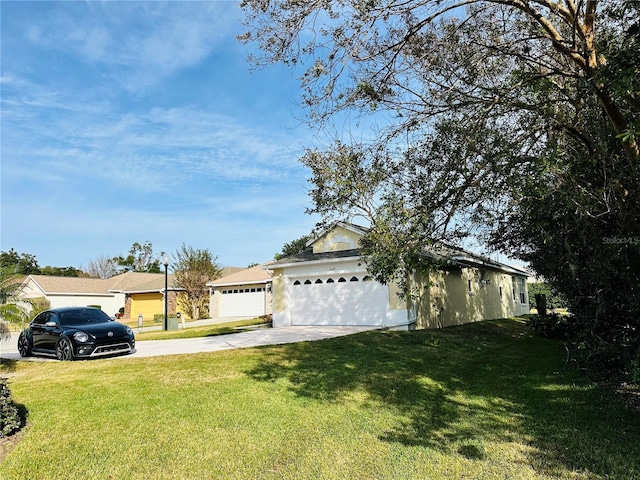 view of front of house with a garage and a front yard