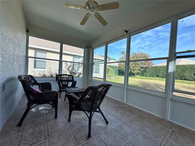 sunroom with ceiling fan