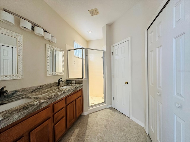 bathroom featuring vanity and walk in shower