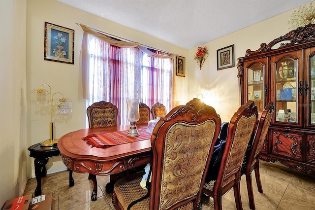 dining room with a textured ceiling