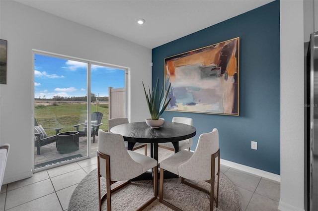 dining area with light tile patterned floors