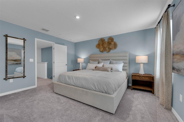 bedroom featuring light carpet