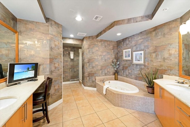 bathroom with tile patterned floors, vanity, and independent shower and bath