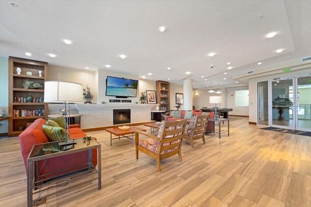 living room with light hardwood / wood-style flooring