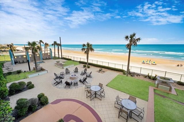 exterior space with a beach view and a water view