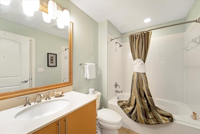 full bathroom with toilet, vanity, and shower / tub combo with curtain